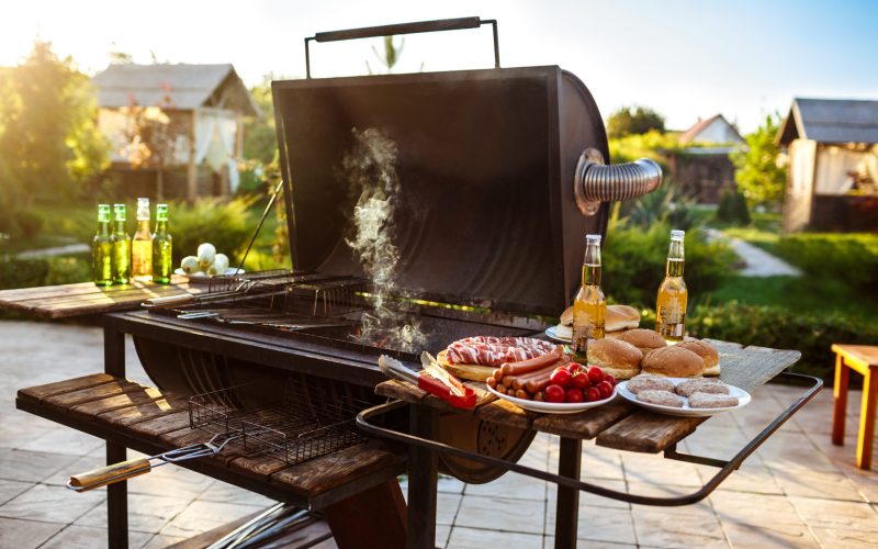 Barbecue grill party. Tasty food on wooden desk. Copy space.